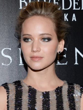 Jennifer Lawrence y Bradley Cooper de premiere con Serena