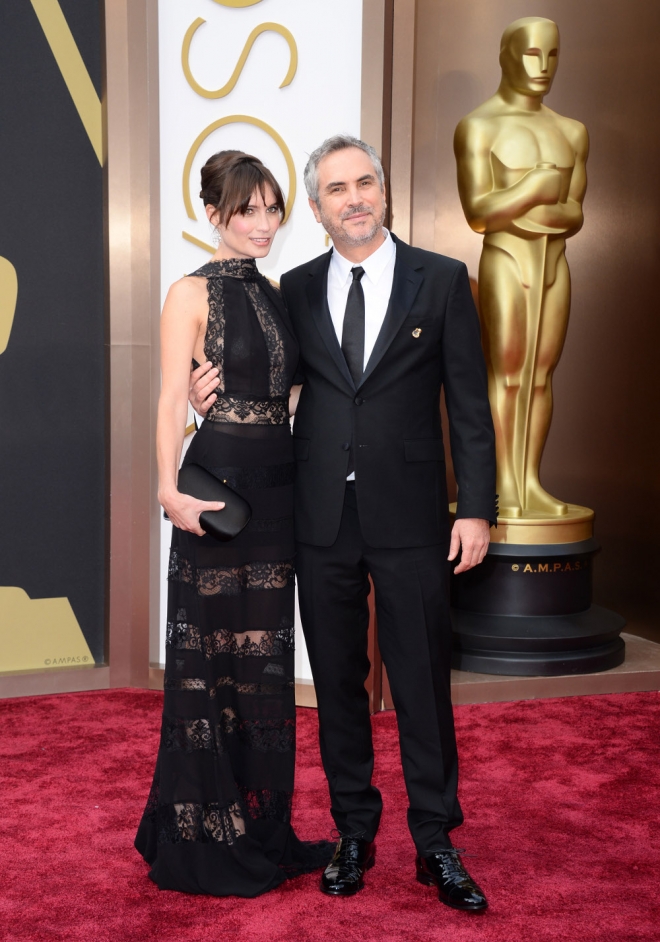 Alfonso Cuaron y Sheherazade Goldsmith, en la alfombra roja de los Oscars 2014