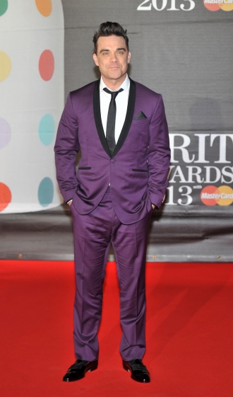 Robbie Williams, encantado con sus trajes coloridos
